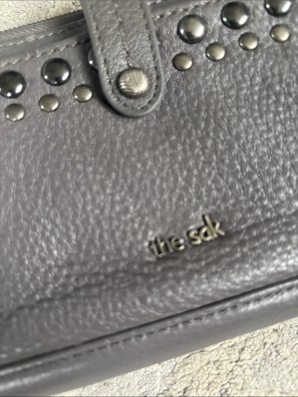 The Sak charcoal gray studded pebbled leather wallet